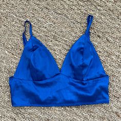 New Without Tags. Adorable Royal Blue Satin Top With Seamed Cups, Adjustable Straps, And Smocked Back. Bust Unstretched 26”, Length From Top Of Cup To Hem 9”. Price Is Final. Bundle To Save! Blue V-neck Crop Top For Vacation, Blue Triangle Crop Top For Summer, Chic Blue V-neck Crop Top, Blue Cami Crop Top For Vacation, Blue Triangle Casual Top, Blue Casual Triangle Top, Blue Cropped Crop Top For Night Out, Casual Blue Triangle Top, Blue V-neck Crop Top For Night Out