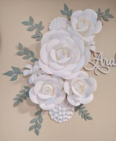 paper flowers are arranged on the wall