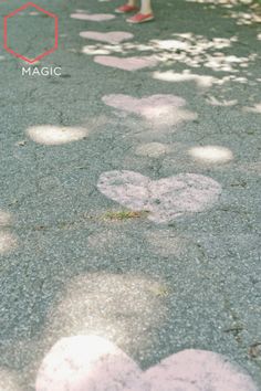 the person is walking down the street with their feet in the air and footprints on the pavement