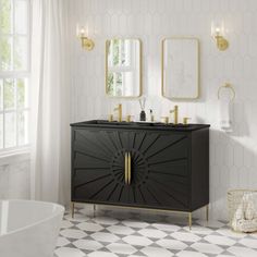 a bathroom with white and black tile flooring, gold accents and mirrors on the wall