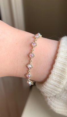 A beautiful handmade bracelet with a crystal star pattern, available in silver or gold and they come in a variety of colours. This bracelet makes the perfect gift for any occasion, and gives a magical vibe to any outfit! The crystals have a stunning iridescent effect, and can be seen in slightly different colours depending on the lighting and angle. They are all reflective so that they glisten and sparkle beautiful colours in the light, to give a true magical feeling to the wearer. I craft my it Elegant Iridescent Handmade Bracelets, Adjustable Silver Mystical Bracelet, Fairy Jewelry Bracelet, Fairy Charm Bracelet, Fairy Bracelets, Charm Bracelet Fairy, Bracelets Design, White Bracelets, Crystal Stars