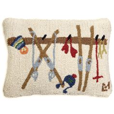 an embroidered pillow with birds hanging on the branch and other items attached to it,