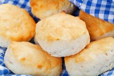 some biscuits are sitting on a blue and white checkered cloth