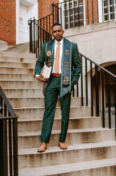 a man in a suit and tie is standing on some stairs with his hands in his pockets