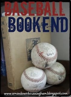 three baseballs sitting on top of a wooden table next to a book with the title, baseball bookend