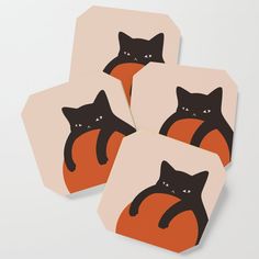 four coasters with black cats on them