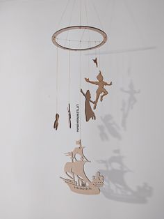 an image of a wind chime that is hanging from the ceiling with people on it