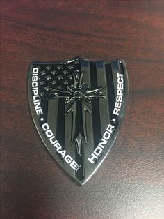 a badge with an american flag on it