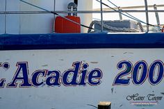 there is a sign on the side of a boat that says l'acadie 200