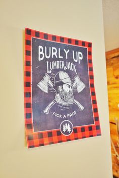 a sign on the wall that says burly up lumber jack and pick a prop