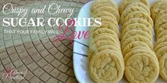 some cookies are on a white plate with the words crispy and chewy sugar cookies that your family will love