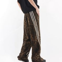 Indulge in the latest fashion trend with our Trending Leopard Print Sweatpants. Made with luxurious materials, these sweatpants exude sophistication and exclusivity. Upgrade your wardrobe with these stylish sweatpants, perfect for lounging or making a statement on the streets. Elevate your style with the touch of leopard print. Features: -85% Polyester -Adjustable Waistband -Solid Color -MId-rise waist -Regular fit Brown Sweatpants For Streetwear In Fall, Brown Relaxed Fit Joggers For Streetwear, Brown Baggy Sweatpants For Streetwear, Brown Stretch Bottoms For Streetwear, Baggy Brown Sweatpants For Streetwear, Stretch Brown Bottoms For Streetwear, Brown Sweatpants For Winter Streetwear, Fall Streetwear Sweatpants Straight Cut, Casual Brown Sweatpants For Streetwear