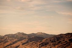 the mountains are brown in color with no clouds