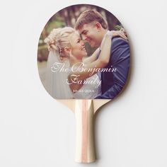 a personalized ping pong paddle with an image of a bride and groom