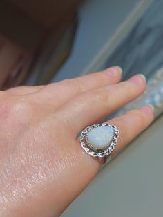 this is very rare fabulous Native American Navajo ring! it is authentic vintage ring in original condition - fabulous condition with only patina to sterling silver. can be polished. the opal displays few natural inclusions of other minerals - see photo. the opal is solid and not doublet and not triplet; it has no cracks and no crazing. intreated rare amazing Nevada opal/Virgin Valley NV I recently acquired a collection of authentic antique/vintage Native American rings with Virgin Valley opal - please find them in my shop and get one - they are very rare , once they gone - they gone.  comes in a ring case and can be gifted immediately!  please also see photos for a description! how beautiful it is!!  fab rare item! please see video in direct indoor light on the granite countertop for color Handmade Southwestern Opal Ring, Heirloom White Opal Ring, Silver Ethiopian Opal Ring With Cabochon, Bohemian Sterling Silver Opal Promise Ring, White Opal Open Ring, Bohemian Opal Promise Ring, Bohemian Opal Promise Ring As Birthstone, Bohemian Opal Birthstone Promise Ring, Bohemian Opal Promise Ring With Birthstone