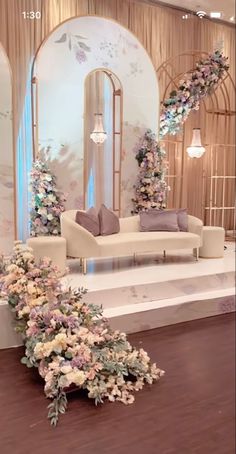 a living room filled with furniture and flowers