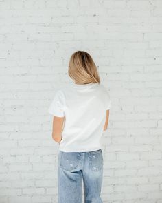 If you’re like all of us and have been looking for THE. PERFECT. TEE……. IT’S HEREEE!!! This white tee is not see through, yet is lightweight, classy and will go with everything. It’s the perfect cropped length that can be tucked in or left out. When we say you need this tee, YOU NEED THIS TEE! True to size being slightly cropped and oversized. ﻿Styled With: ﻿90's High Rise Straight Jeans Model Info: Makena is 5’6 wearing size Small. Trendy White Cropped T-shirt For Everyday, White Cotton Cropped T-shirt For Everyday, Everyday White Cotton Cropped T-shirt, White Cropped T-shirt For Everyday Summer Wear, White Casual Cropped T-shirt For Everyday, White Relaxed Fit Cropped T-shirt For Everyday, Simple White Cropped T-shirt For Summer, Simple White Tops With Graphic Print, White Casual Basic Tops