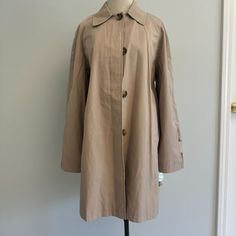 Perfect Condition With Tags Khaki With Super Cute Lining. Button Detailing. Water Repellent. 35 Inches From Top To Bottom. Classic Outerwear With Button Cuffs, Classic Outerwear With Button Cuffs For Daywear, Classic Beige Outerwear With Snap Buttons, Long Coat Outerwear With Button Closure For Daywear, Classic Single Breasted Outerwear For Daywear, Classic Single-breasted Outerwear For Daywear, Long Coat With Button Closure For Daywear, Beige Button-up Outerwear With Covered Buttons, Classic Spring Outerwear With Button Closure