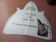 a piece of paper cut out to look like a pitcher with instructions on the side