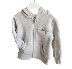 Fleece lined full zip-up hoodie. All styles include custom embroidery with your choice of phrase, font, thread color + text placement. Please make selections below. Material Content: 50% polyester, 37% ringspun cotton, 13% rayon Mockups provided upon request, please contact us. Click here for embroidery ideas *Style runs true to size, when in doubt size up :) ﻿Matches Little Kids Zip-Up Fleece Hoodie , Big Kids Zip-Up Fleece Hoodie, + Adult Zip-Up Fleece Hoodie Personalized Long Sleeve Cotton Hoodie, Personalized Cotton Sweatshirt For Winter, Casual Personalized Hooded Hoodie, Personalized Cotton Hoodie For Winter, Casual Personalized Cotton Hoodie, Casual Cotton Hoodie Personalized, Casual Cotton Hoodie With Custom Text, Custom Embroidered Fleece Hoodie, Customizable Cotton Winter Hoodie