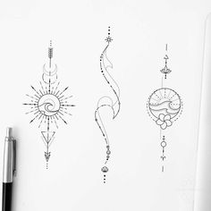 three different designs on a sheet of paper next to a pen and ink drawing pencil