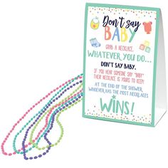 a card that says don't say baby whatever you do with beads on it