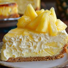 a piece of cheesecake with pineapple on top