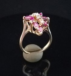 Lady's Ruby and Diamond Cocktail Ring.  The stones in this are very fine quality and appear very free of inclusions.  All the stones are natural, not crystal or synthetic. Mother Nature made these.  Even though this ring is used it has almost no wear.  It's 14k Yellow Gold, Size 6 and weighs 4.75 Grams total weight.  This ring is a steal at this price! Diamond White Marquise Multi-stone Ring, Diamond White Multi-stone Marquise Rings, Oval Multi-stone Ruby Ring In White Gold, Fine Jewelry Marquise Multi-stone Ring, Vintage Multi-stone Diamond White Rings, Formal Marquise Multi-stone Ruby Ring, Formal Multi-stone Marquise Ruby Ring, Diamond White Multi-stone Fine Jewelry Ring, Marquise White Gold Ruby Ring