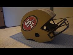 a football helmet sitting on top of a mat