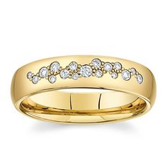 a yellow gold wedding ring with five diamonds