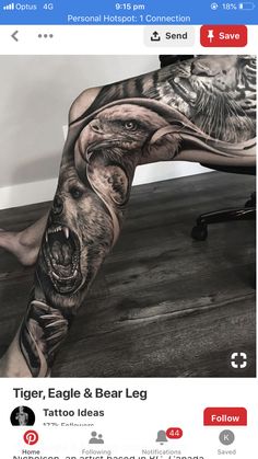 a man's leg with tattoos on it and an image of a bear in the background