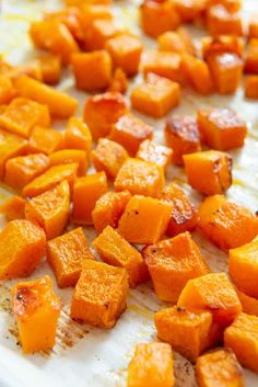 chopped up sweet potatoes on a cutting board