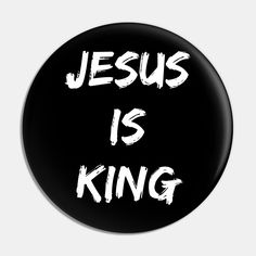 a black button with the words jesus is king on it