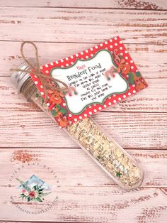 a bottle with some food in it on top of a wooden table next to a tag