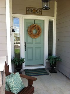 a front door with a wreath on it