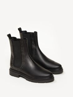 The Graziana has all the markers of a classic Chelsea boot—supple Italian leather upper, elastic side panels, and a durable lug sole—but a double row of tiny silver studs set this pair apart. They’re sturdy yet stylish, a winning combination for all-day wear. Stud Set, Boots And Sneakers, Chelsea Boot, Lug Sole, Side Panels, Boots For Sale, Boot Shop, Shoe Sale, Silver Studs