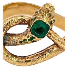 Here we go again with another magnificent snake bracelet. By now you all know that I love snake jewelry and I am always on the lookout for great special snakes. This snake bracelet comes out of France is is from the turn of the century approximately 1900 to 1910 and has a full etches or chased front. At one time there was green enamel around the head but that has faded but it does not distract from the beauty of this piece. The Emerald Head is synthetic the rest is gorgeous. This weighs 20.38 gr Antique Snake-shaped Yellow Gold Jewelry, Luxury Snake Ring With 17 Jewels For Gift, Elegant Engraved Snake-shaped Jewelry, Antique Gold Snake-shaped Jewelry, Antique Snake Ring As Gift, Vintage Snake-shape Jewelry For Formal Occasions, Vintage Snake-shaped Jewelry Gift, Luxury Snake-shaped Jewelry Gift, Luxury Snake-shaped Jewelry For Gifts