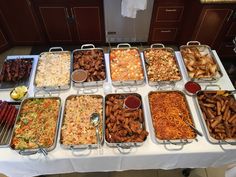 a buffet table filled with lots of different foods