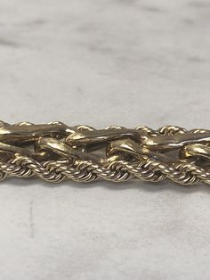 "14kt Yellow Gold Lady's Bracelet 8\" in length custom-made with 3mm solid rope chains and a wheat weave style link pattern all created to make this unusual bracelet. The hidden solid box clasp has a fig 8 safety secure clasp. The gold is bright, shiny and very comfortable to wear with a lot of flexibility. This bracelet weighs 32.6 grams This item would Retail for $4,735.00" Classic Rope Chain Bracelets For Formal Occasions, Formal Gold Braided Jubilee Bracelet, Classic Formal Rope Chain Bracelets, Formal Gold Braided Jubilee Style Bracelet, Classic Formal Rope Chain Bracelet, Formal 14k Gold Bracelets With Rope Chain, Formal Rope Chain Bracelet Jewelry, Formal Yellow Gold Rope Chain Bracelet, Formal Rope Chain Bracelet