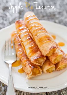 some food is on a white plate with a fork