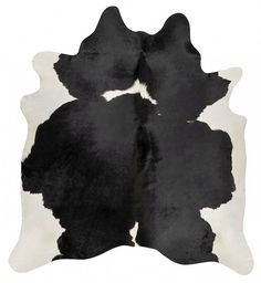 a black and white cowhide rug on a white background