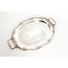 an ornate silver serving tray with handles