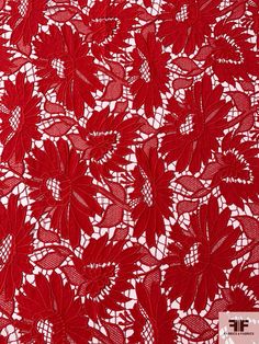 red lace fabric with flowers on it