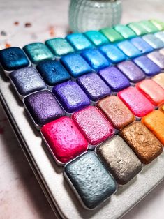 a close up of a rainbow colored keyboard