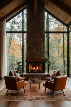 a living room with two chairs and a fire place in the middle of the room