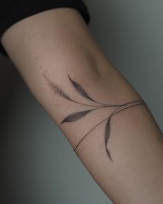 a woman's arm with a tattoo design on the left side of her body