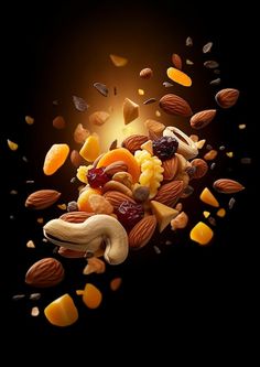 nuts and dried fruits falling into the air