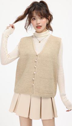 Beige Knitted V-Neck Cardigan Vest Beige S Beige Knitted V-neck Cardigan, Beige V-neck Sweater For Fall Layering, Beige Knit V-neck Cardigan, Cream Knit V-neck Outerwear, Knitted Solid Color Sweater Vest For Spring, Spring Knitted Sweater Vest, Cream V-neck Cardigan, Knitted Sweater Vest For Winter, Beige Textured Knit Sweater Vest For Layering