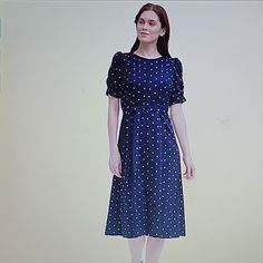 Dkny Navy Blue And White Polka Dot Dress. Rounded Neckline. Short Puffed Sleeve With Elastic Ruching. Hidden Back Zipper. Fitted Waistline With Self Fabric Belt. A Line Skirt. Stretch Fabric Is 95% Polyester 5% Spandex. Machine Washable. Size 10. Approximate Measurements 19" From Pit To Pit. 15" Across Waist 49" From Shoulder To Hem. New With Tags Day-To-Night: Dkny Dresses Are Designed To Move With You Throughout Your Day; From The Office To Date Night, These Styles Can Be Dressed Up Or Down. Polka Dot Knee-length Midi Dress For Daywear, Fitted Dress Short, Shift Dresses Work, Short Fitted Dress, Royal Blue Shorts, Dkny Dress, Gold Sequin Dress, White Polka Dot Dress, Stretch Belt