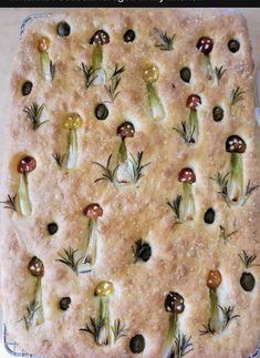 a square pastry with mushrooms and herbs on it